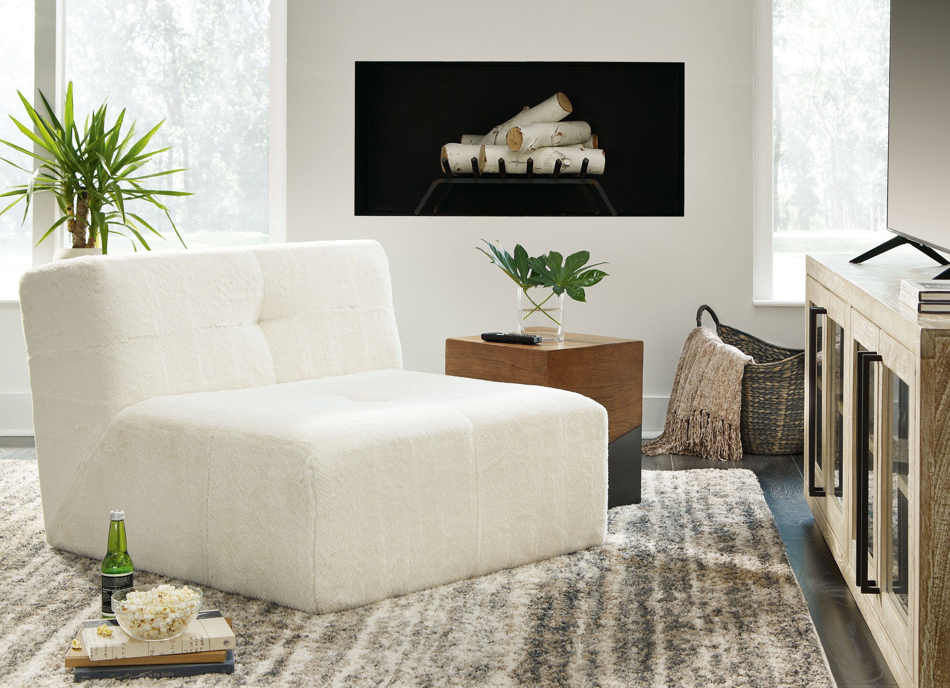 Ivory accent chair with textured upholstery, rounded back, and thick seat cushion