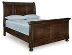 Dark brown sleigh bed frame with upholstered headboard and footboard panels