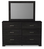 Black dresser with mirror, two-by-two drawer layout with silver bar pulls