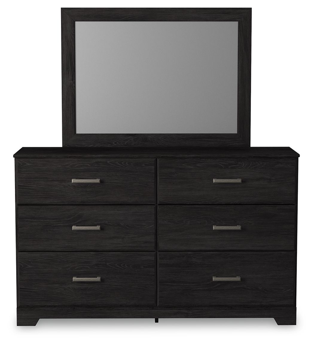 Black dresser with mirror, two-by-two drawer layout with silver bar pulls