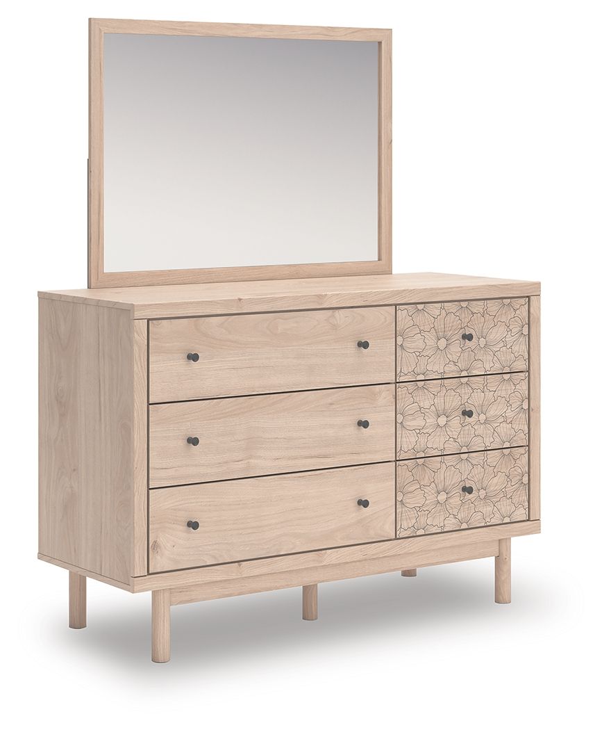 Wood dresser with mirror and floral-patterned side drawers, three front drawers
