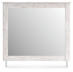 Bedroom mirror with whitewashed wood frame, front view with clear reflective surface