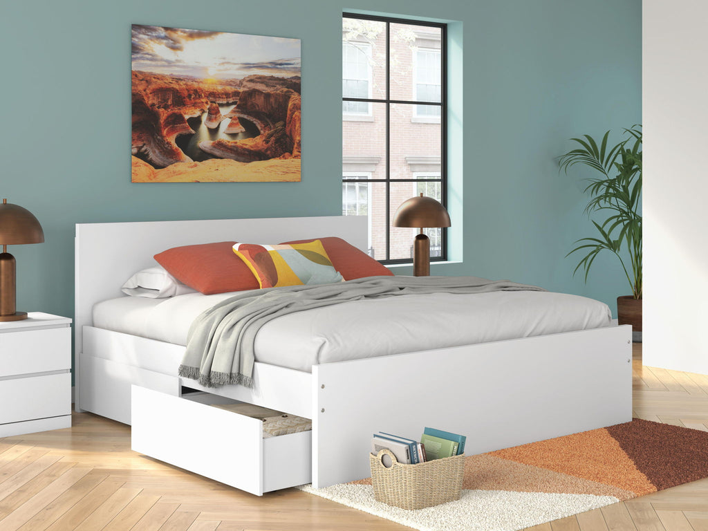 White platform bed with front drawer storage and panel headboard