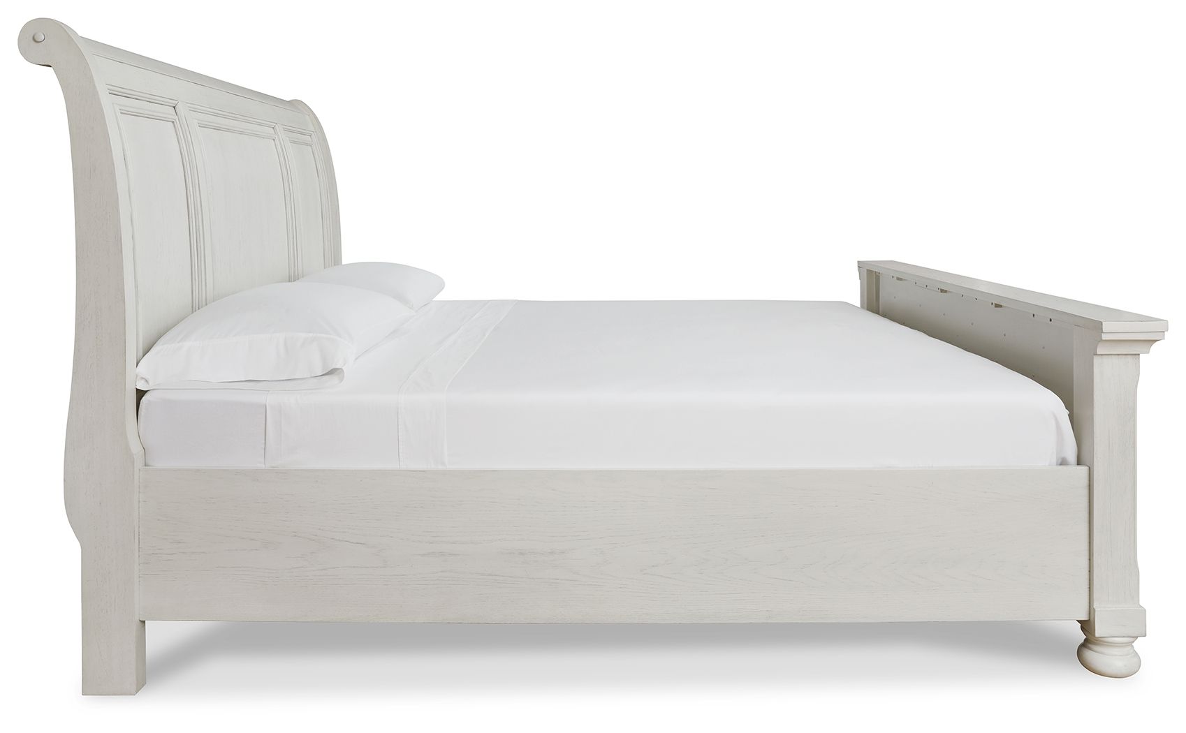 White sleigh bed with rounded headboard and low footboard, simple wood frame.