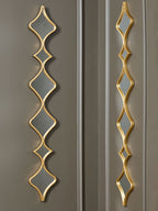 Gold accent mirrors set of two vertical diamond frames with gray reflections on glass
