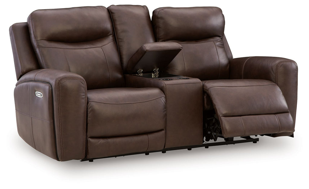 Dark brown power reclining loveseat with padded armrests and console, adjustable headrests.
