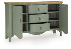 Antique green accent cabinet with open shelves and three drawers, brass pulls