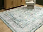 Ladstoney rug featuring medallion design in pale blue with beige framing border