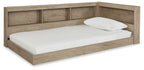 Beige storage bed with paneled headboard and open shelves, white pillows
