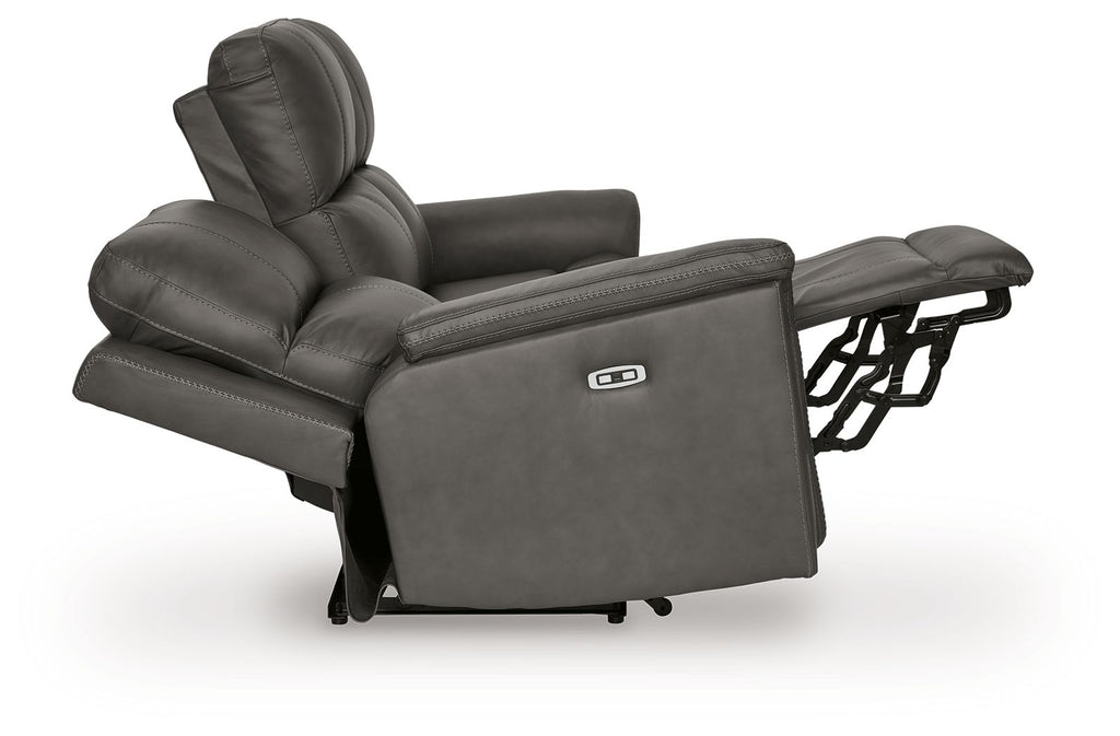 Gray power reclining sofa showing extended footrest and adjustable headrest