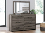 Gray-brown wooden dresser with mirror and six drawers with bar pulls