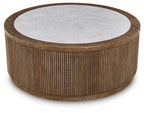 Round side table with gray circular top and light brown vertical slat wood sides.