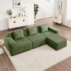 Green corduroy modular sectional sofa with chaise and throw pillows