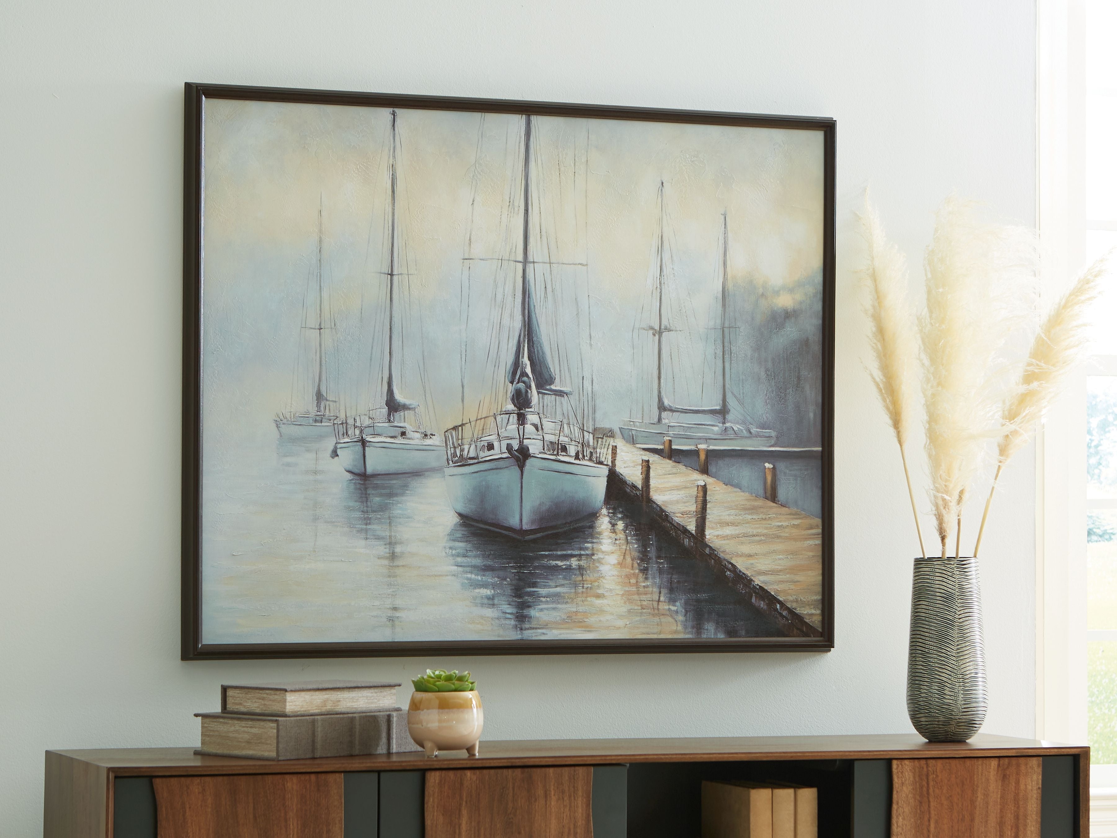 Framed sailboat wall art featuring blue dock and moored sailboats