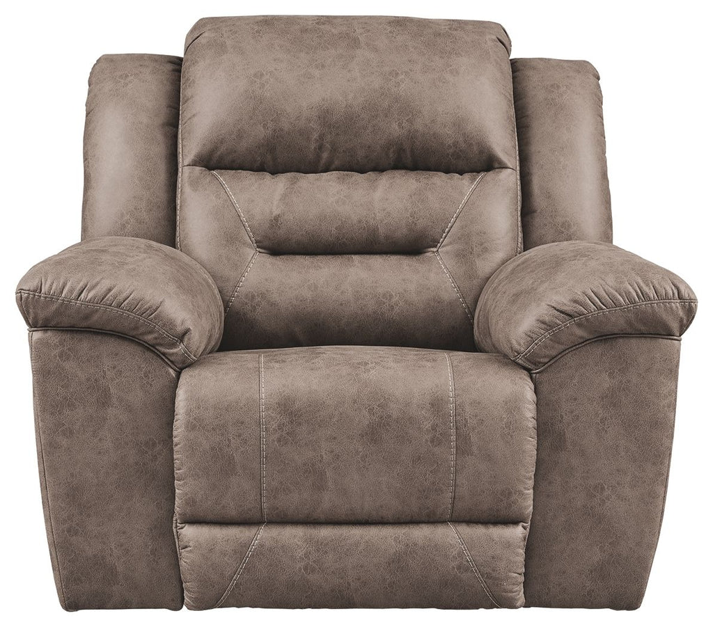 Taupe recliner chair with cushioned headrest, padded arms, and center seam panel