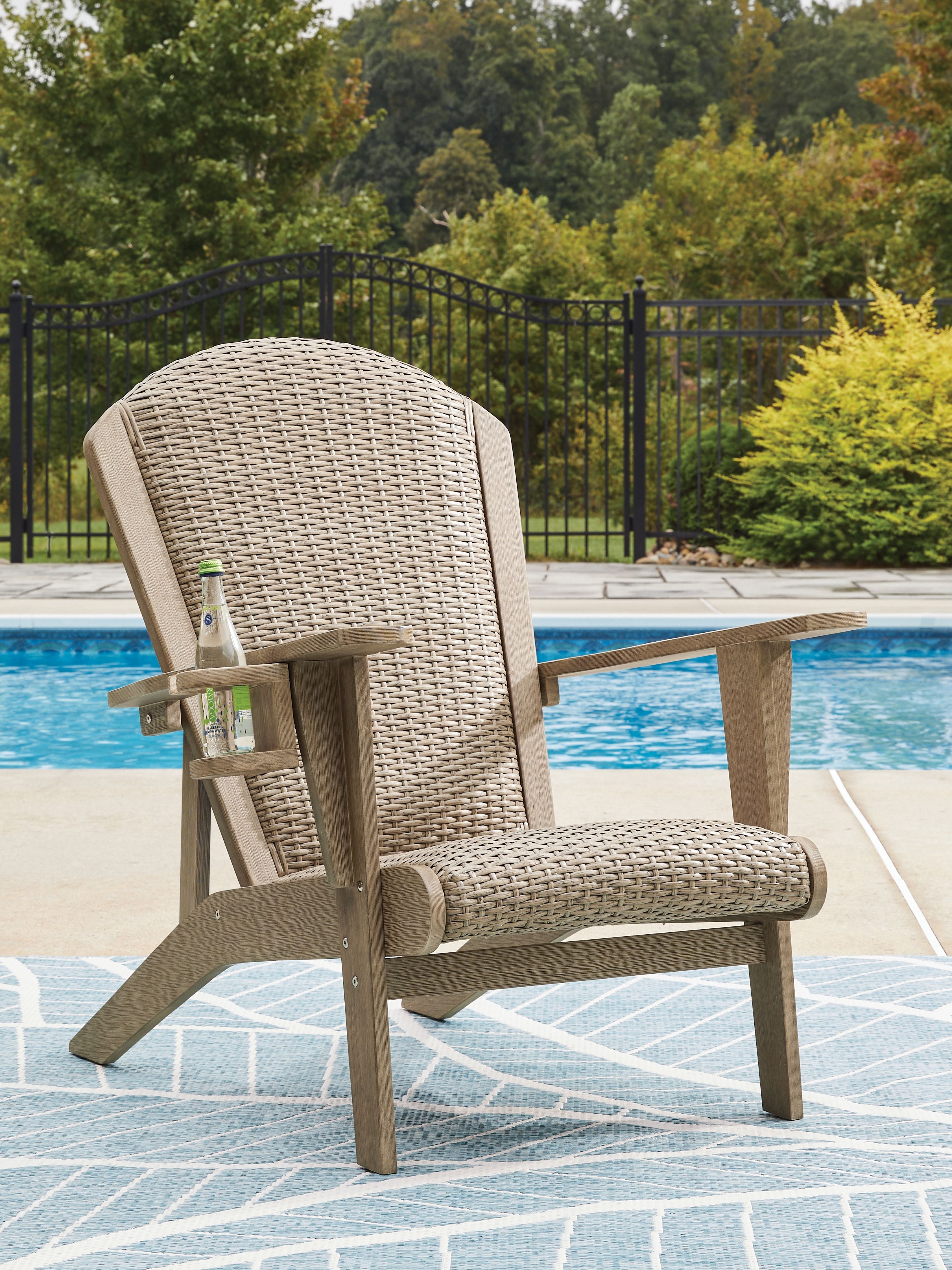 Marina Sun Adirondack chair in beige woven upholstery with wooden frame and arms