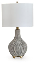 Ceramic table lamp with gray ribbed base, gold accents, and white fabric shade