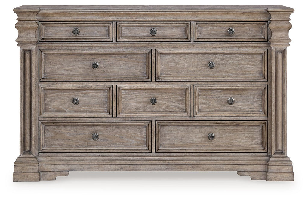 Light gray-brown dresser front with six drawers and round metal knobs.