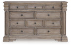 Light gray-brown dresser front with six drawers and round metal knobs.