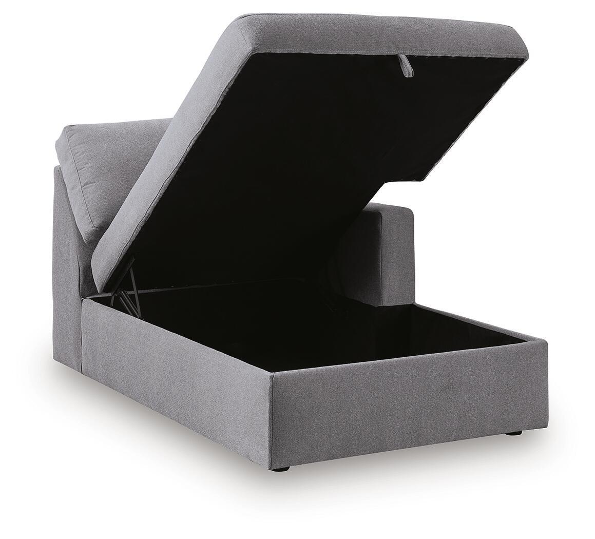 Gray corner chaise storage box with open lid, showing dark interior