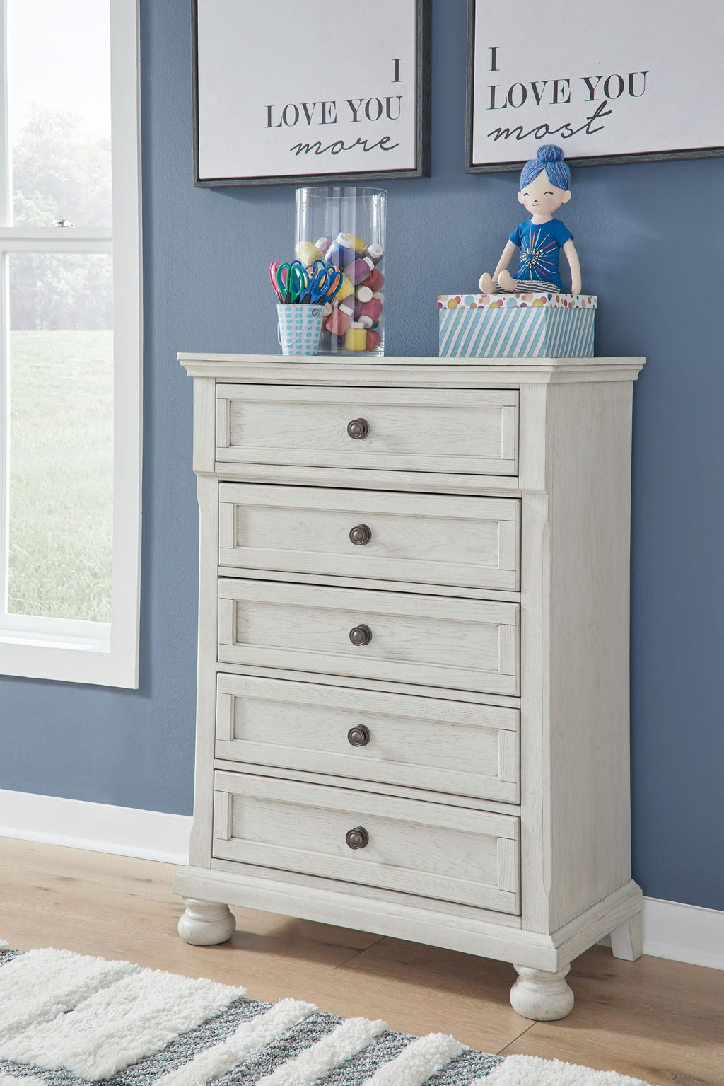 White youth sleigh dresser with five drawers and centered pull hardware