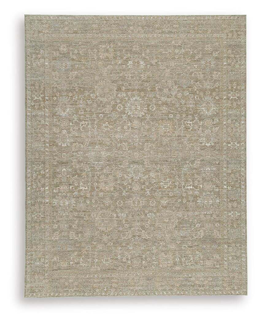 Light brown rectangular flatweave rug with subtle distressed speckle and scattered motifs