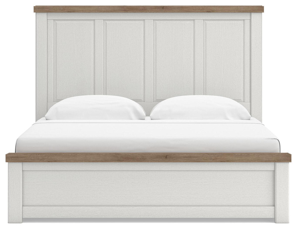 White panel bed with paneled headboard, light wood top rail, cushioned mattress