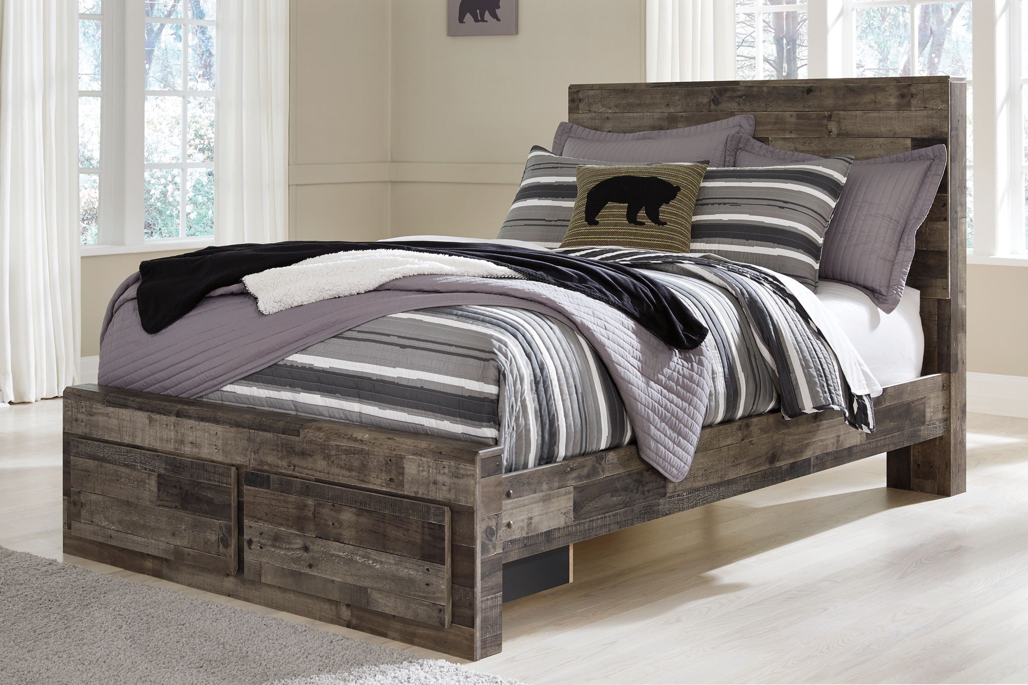 Panel bed with storage drawers, dark gray wood-look finish, side view with layered bedding