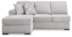 Light gray fabric sofa chaise with left chaise, three seat blocks, and back pillows