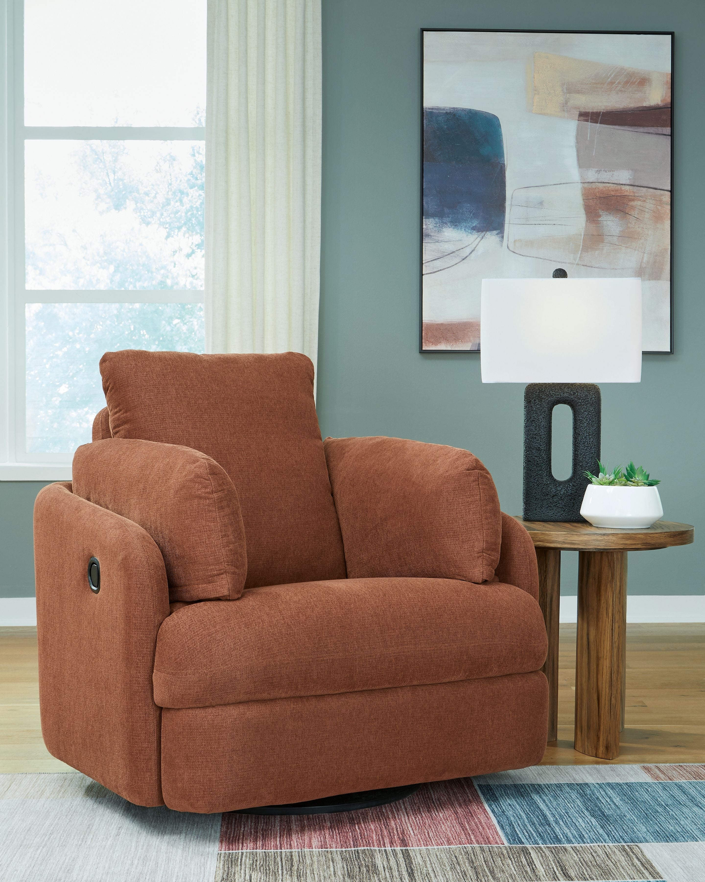 Swivel glider recliner chair in brown fabric with padded headrest and rounded arms.