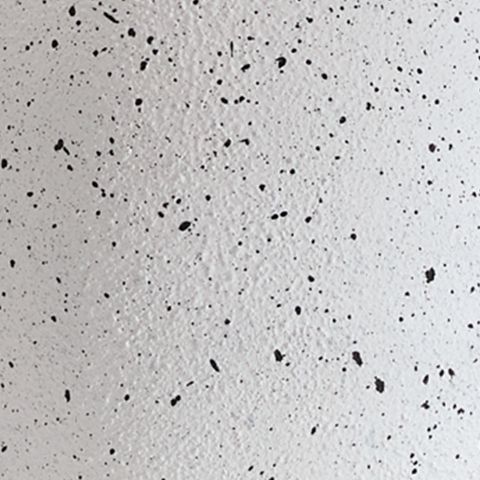 Speckled white metal lamp base texture close-up