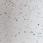 Speckled white metal lamp base texture close-up