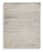 Beige rug with textured geometric pattern of concentric diamonds, flatweave look