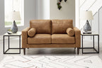 Caramel-brown loveseat with two-seat design and rounded rolled arms, styled in room.