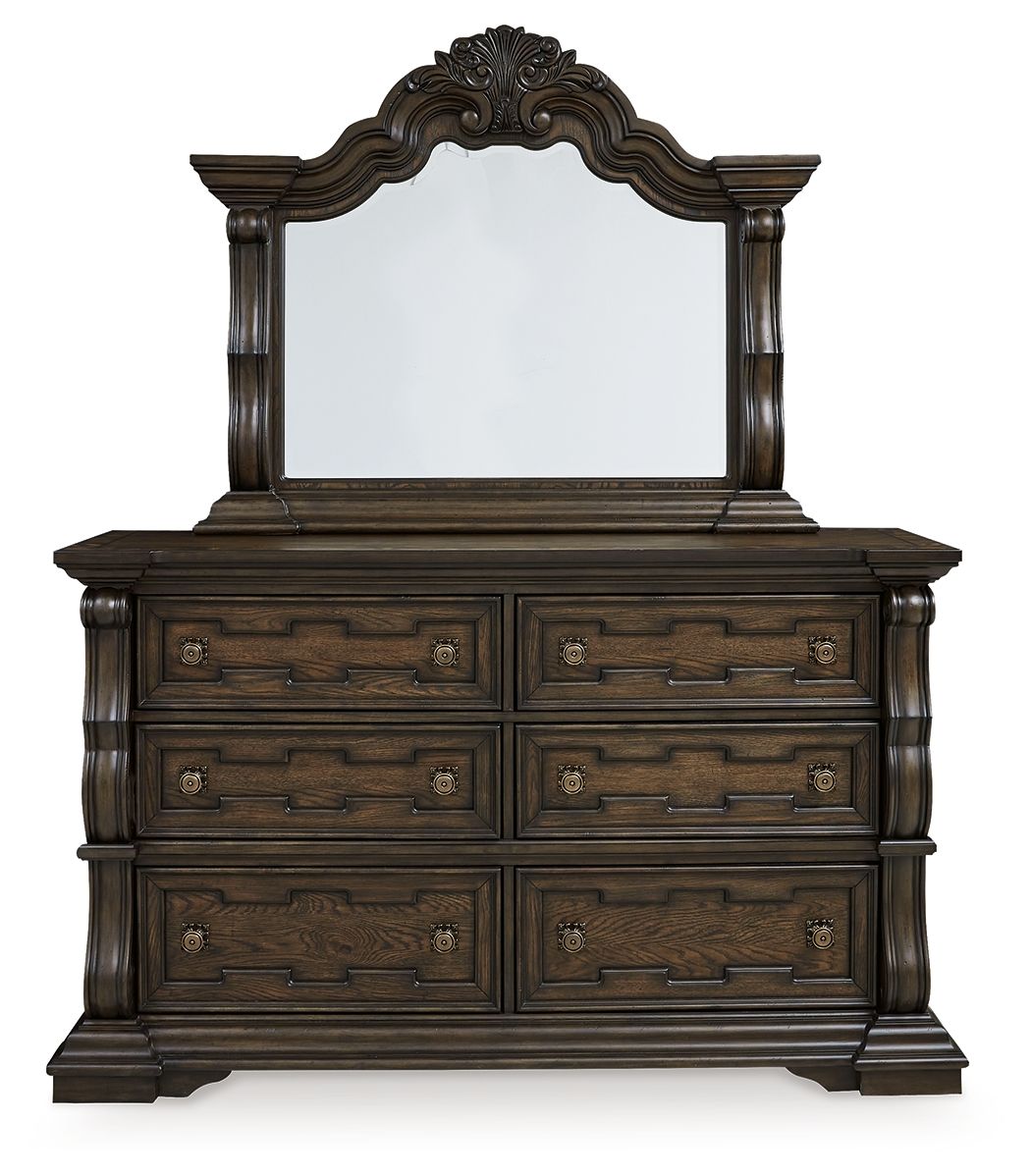 Dark brown dresser with arched mirror and six drawers, decorative raised molding