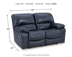 Power reclining loveseat, dark blue faux leather, side view with compact base