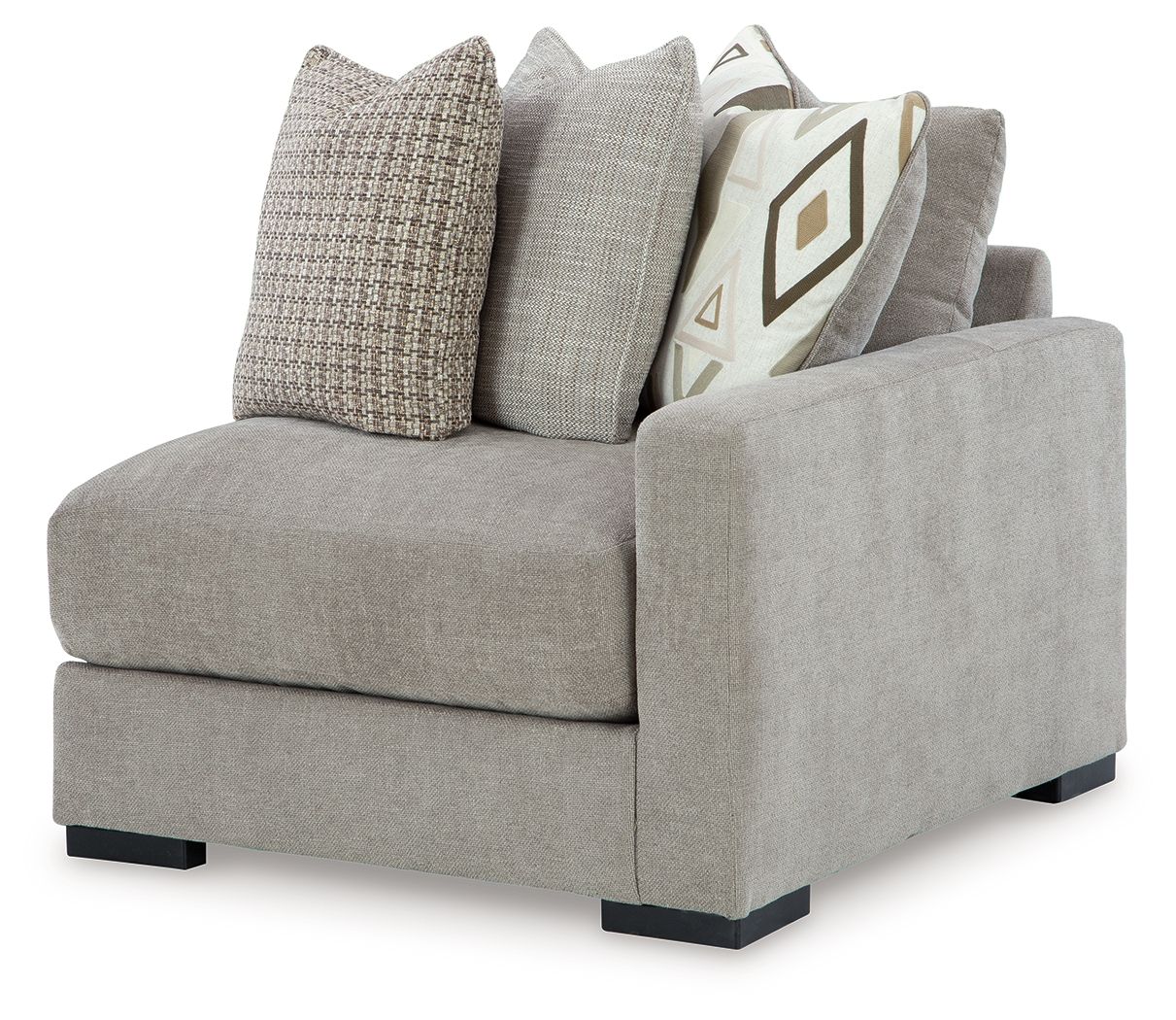 Light gray corner armchair with dark feet and solid plus patterned throw pillows