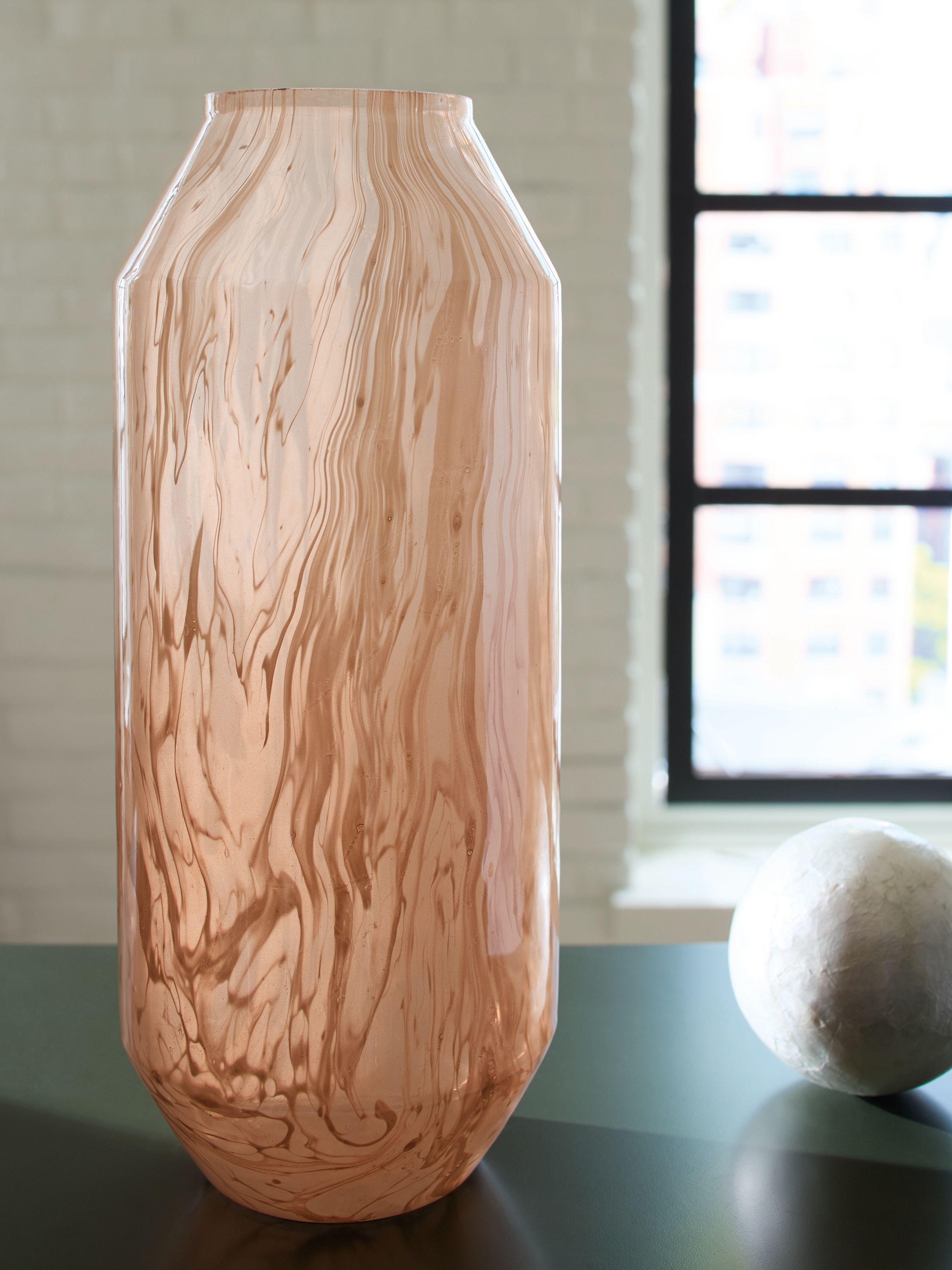 Light brown carved woodgrain vase with narrow neck and flared rim