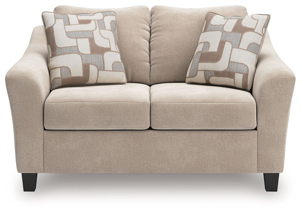 Taupe upholstered loveseat with two seat cushions and two geometric throw pillows