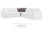 White fabric sectional wedge with attached back cushions and short armrests