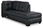Corner chaise with dark charcoal leather-like fabric, tufted seat and back, block legs