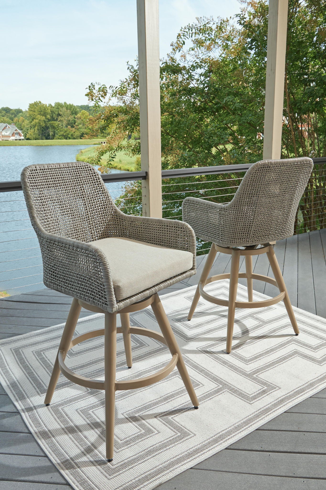 Two-arm bar stools set of 2 with gray woven upholstery, beige seat cushions, wood bases
