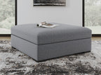 Oversized accent ottoman in salt-and-pepper gray fabric, low cube shape