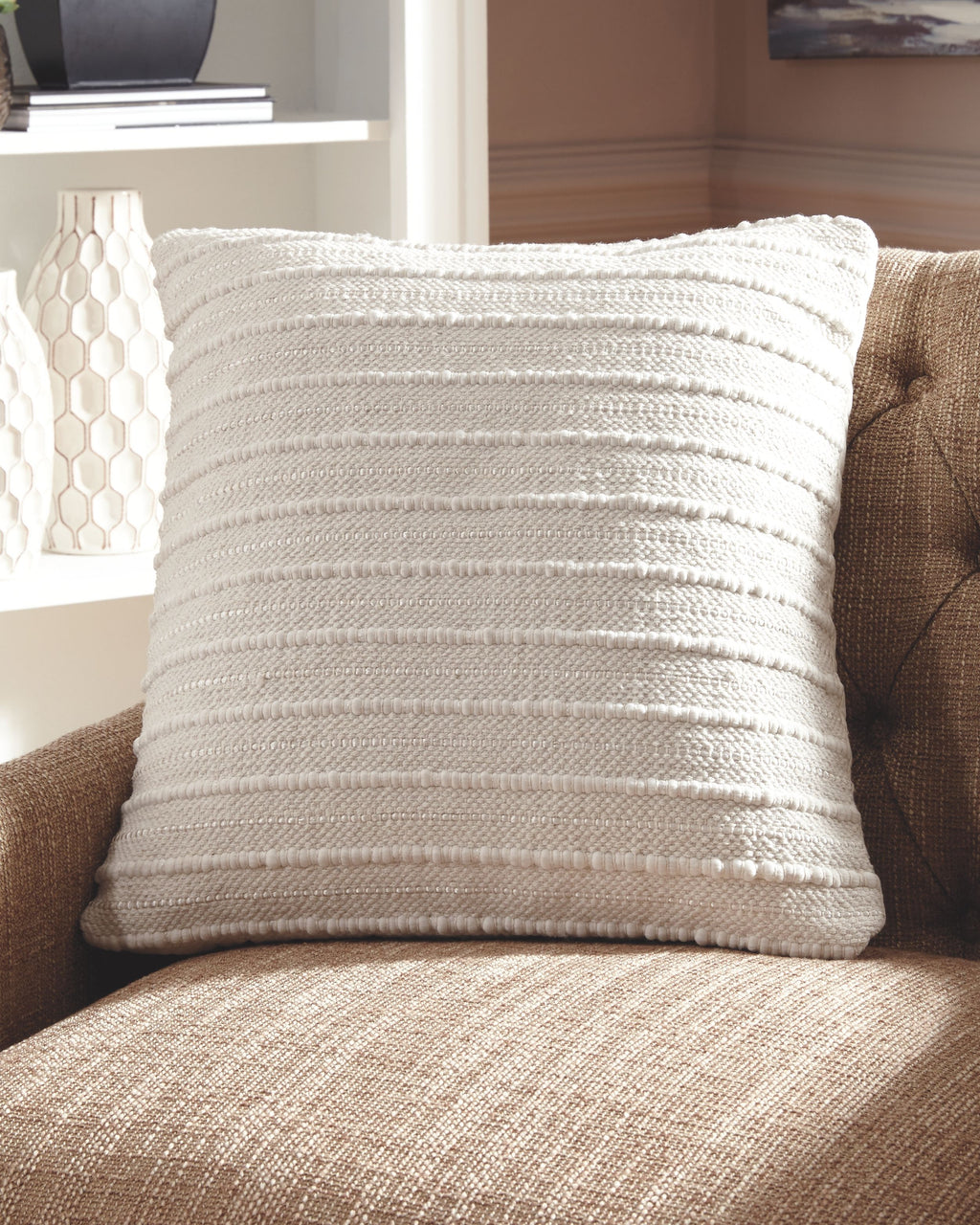 Theban beige throw pillow with textured weave and stitched horizontal lines