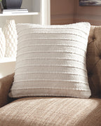 Theban beige throw pillow with textured weave and stitched horizontal lines