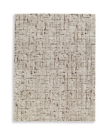 Light brown rug with distressed geometric pattern, short pile texture