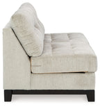 Stone armless loveseat with thick padded armrest, tufted seat cushion, dark legs