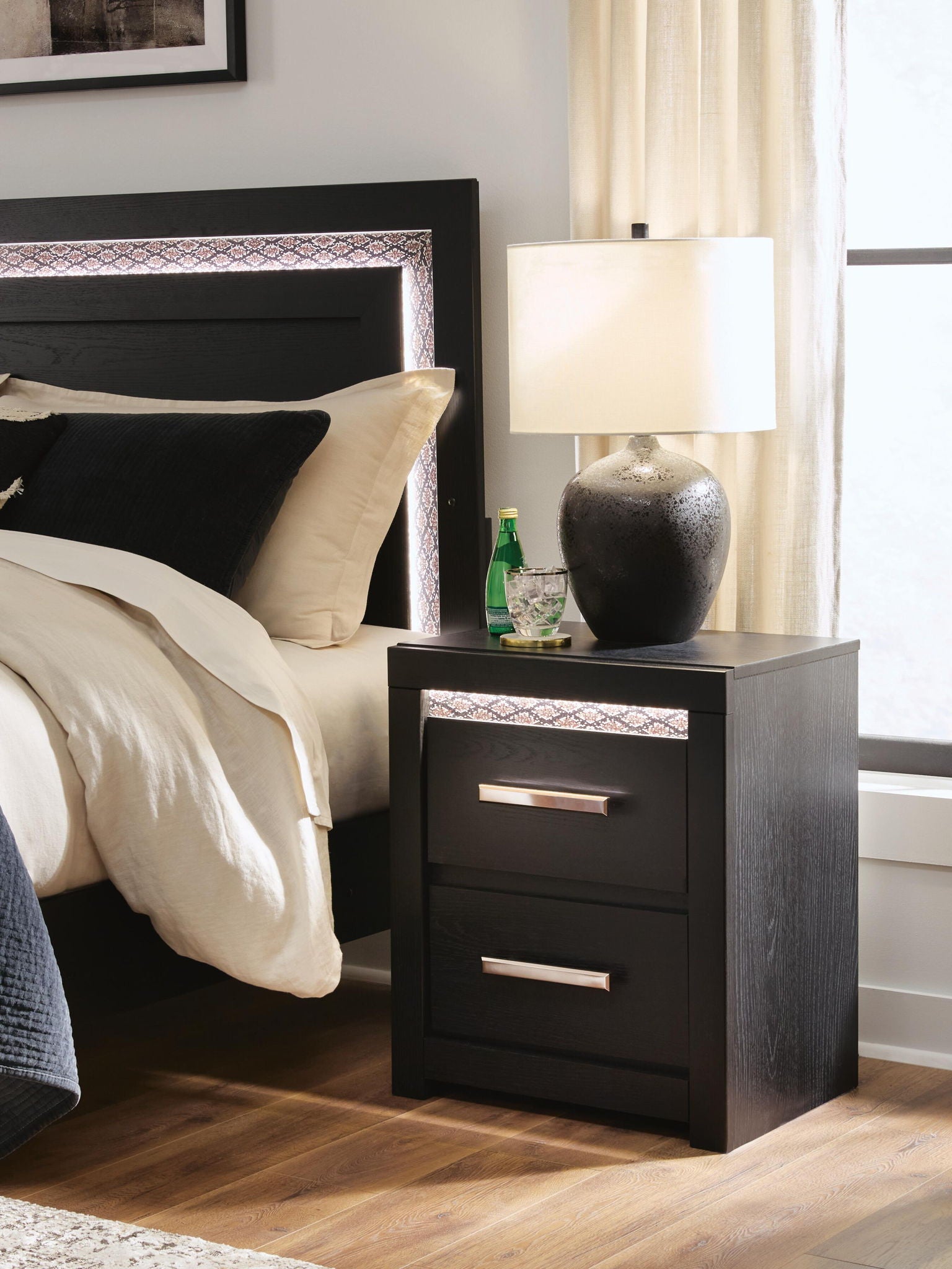 Black two-drawer nightstand with chrome bar handles and open shelf