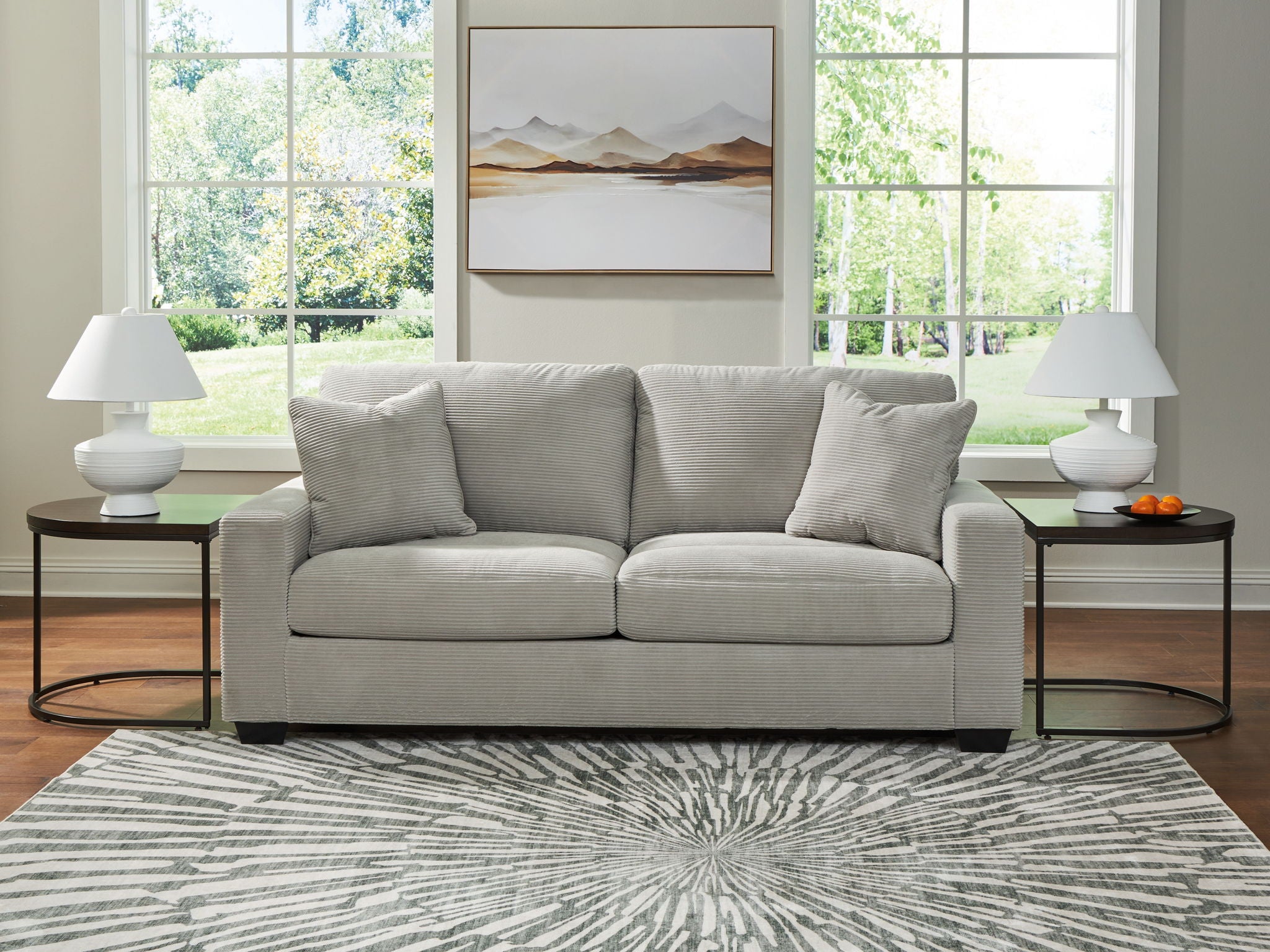 Greenbriar sofa with light gray upholstery, four throw pillows, square block legs