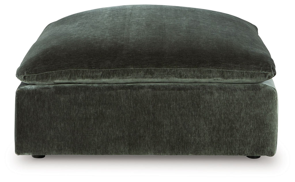 Jade green upholstered accent ottoman with rounded top and cushioned base